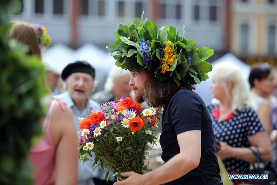 People visit Midsummer festival Ligo market in Riga, Latvia - Xinhua