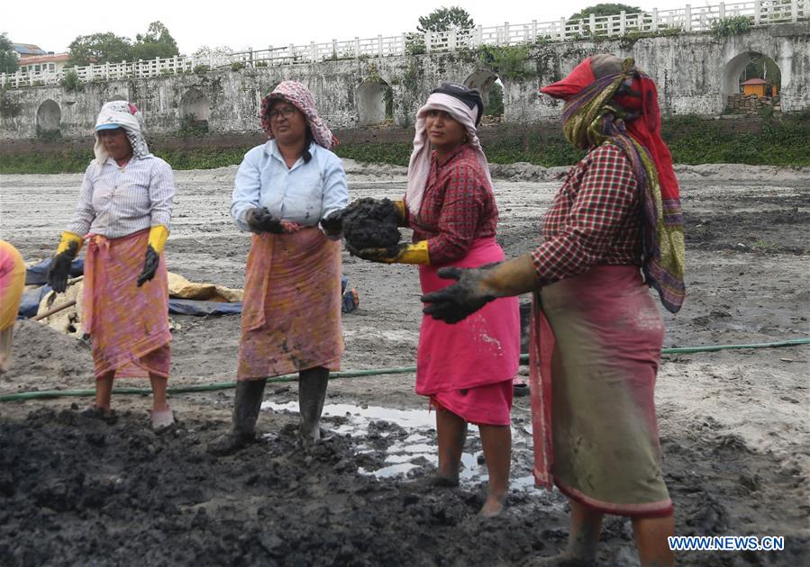 NEPAL-KATHMANDU-RANIPOKHARI POND-RECONSTRUCTION-FEMALE WORKERS