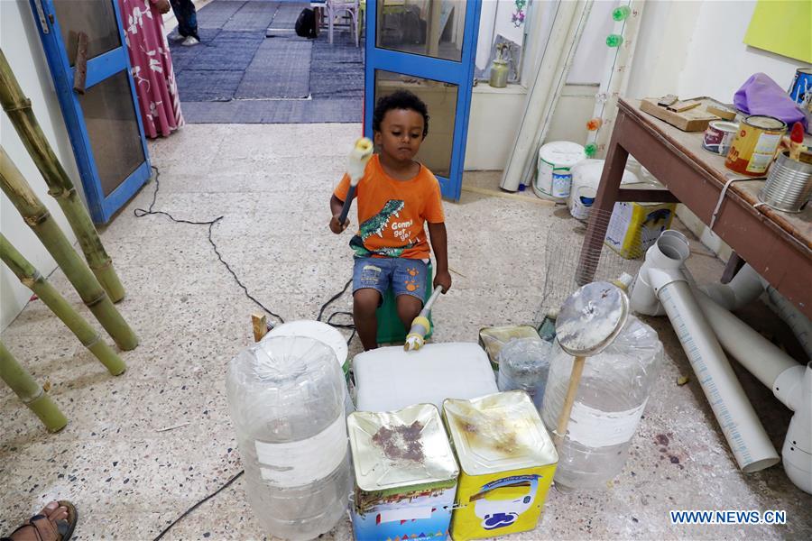 EGYPT- LUXOR-GARBAGE INTO MUSICAL INSTRUMENTS