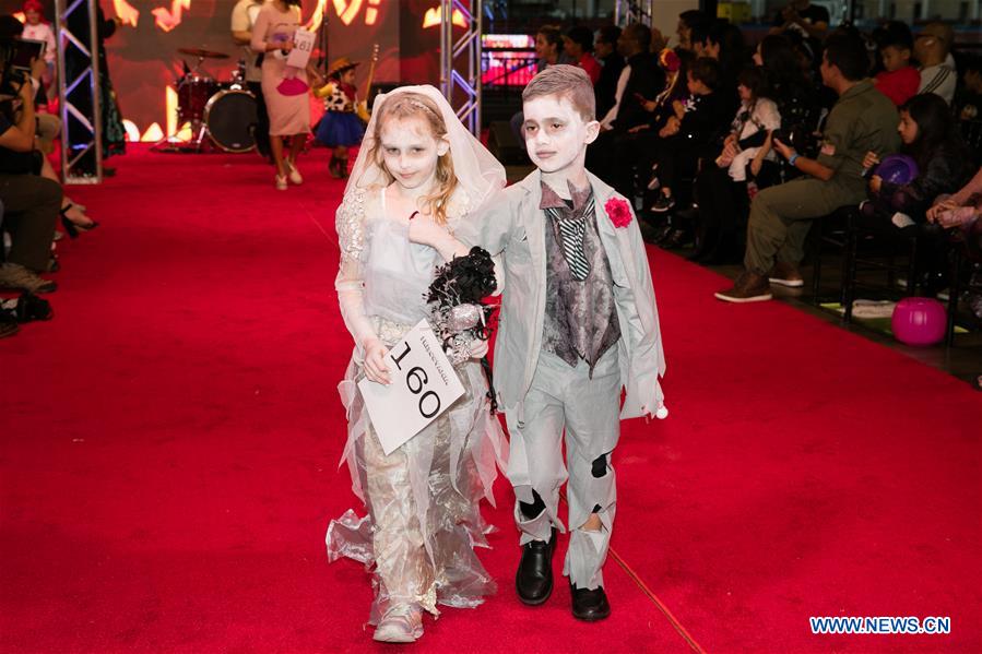 People participate in Halloween costume contest in Frisco, U.S