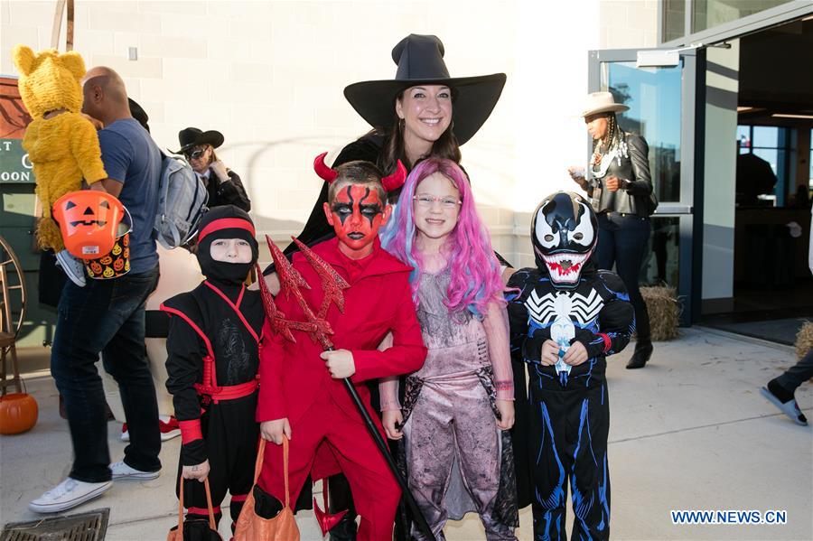 People participate in Halloween costume contest in Frisco, U.S