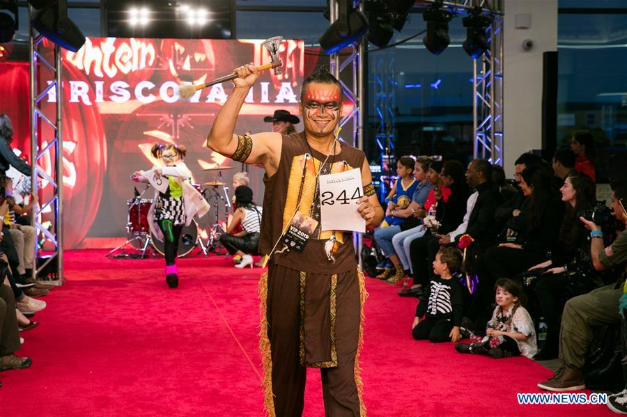 People participate in Halloween costume contest in Frisco, U.S