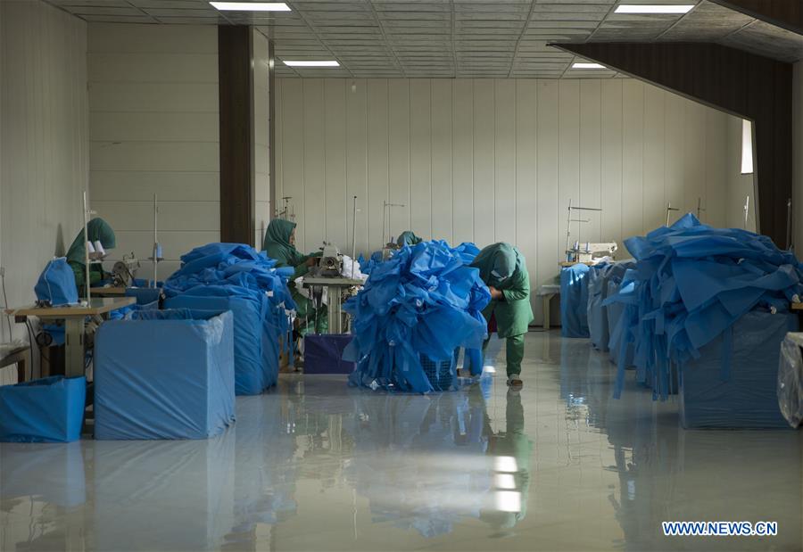 Afghan women work at surgical gown factory in Herat Province Xinhua