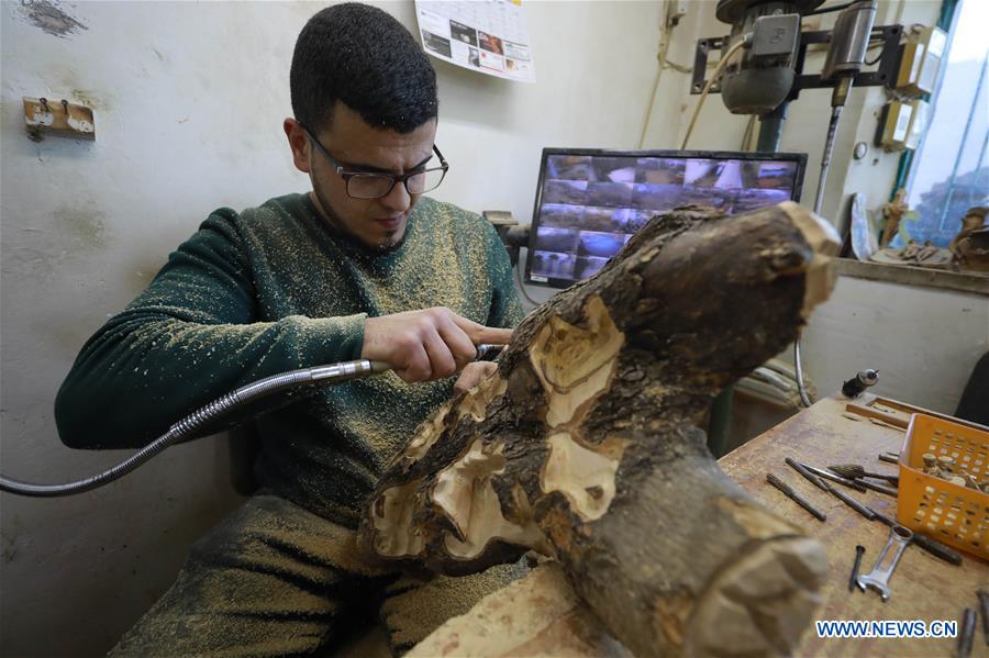 MIDEAST-BETHLEHEM-CARPENTER-WOOD-STATUE