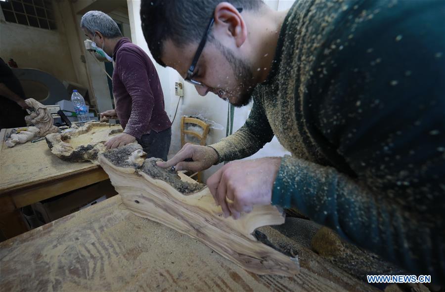 MIDEAST-BETHLEHEM-CARPENTER-WOOD-STATUE