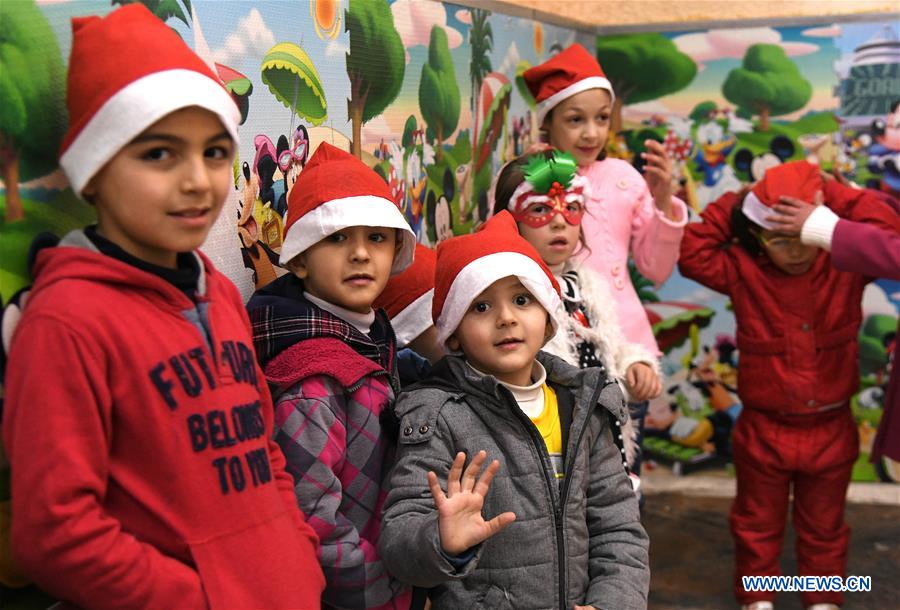 SYRIA-DAMASCUS-CHRISTMAS-CELEBRATION-CHILDREN