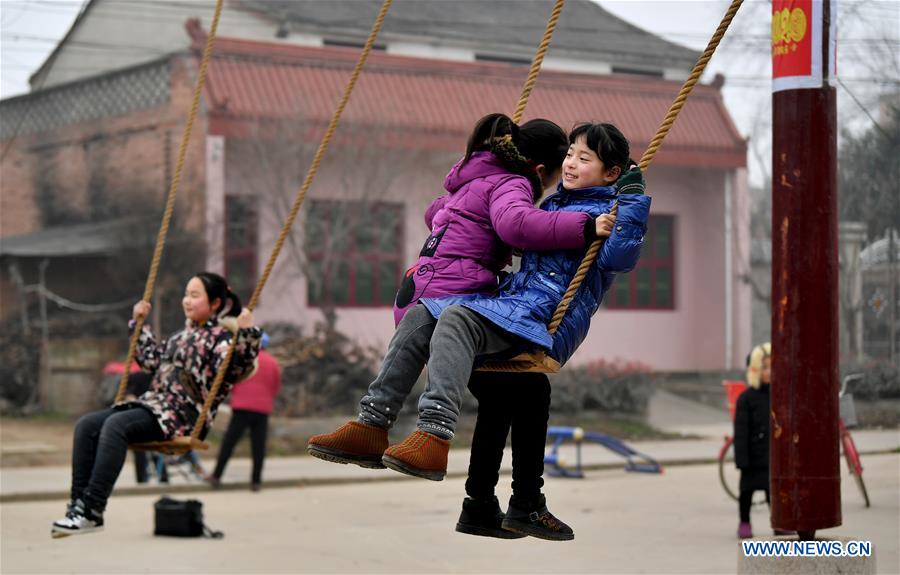 Villagers play on swing as tradition to greet Spring Festival