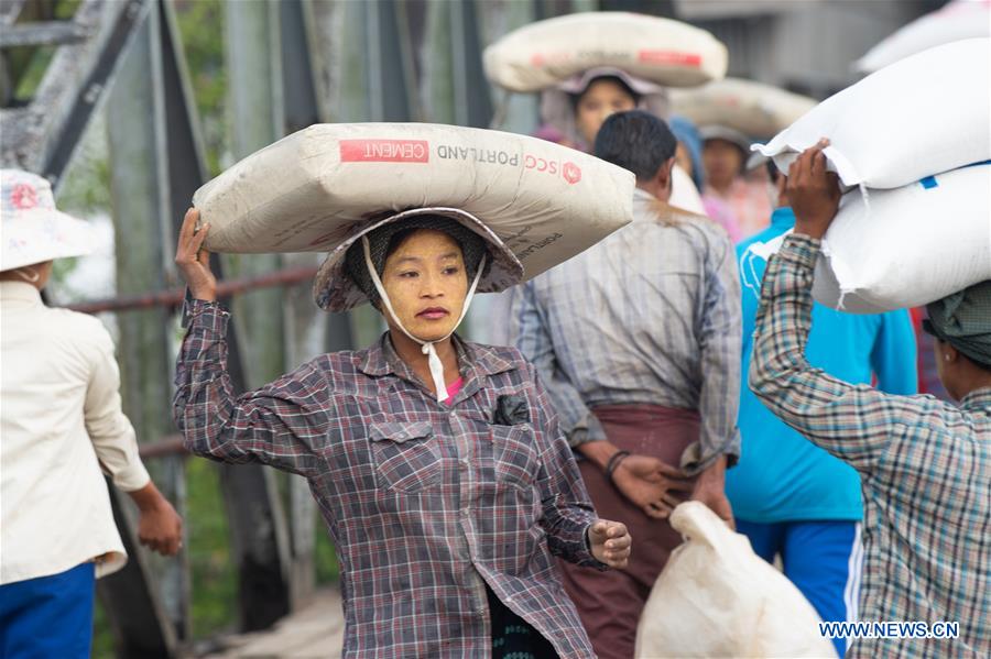 MYANMAR-KYAUKPYU-PIER-FEMALE WORKER