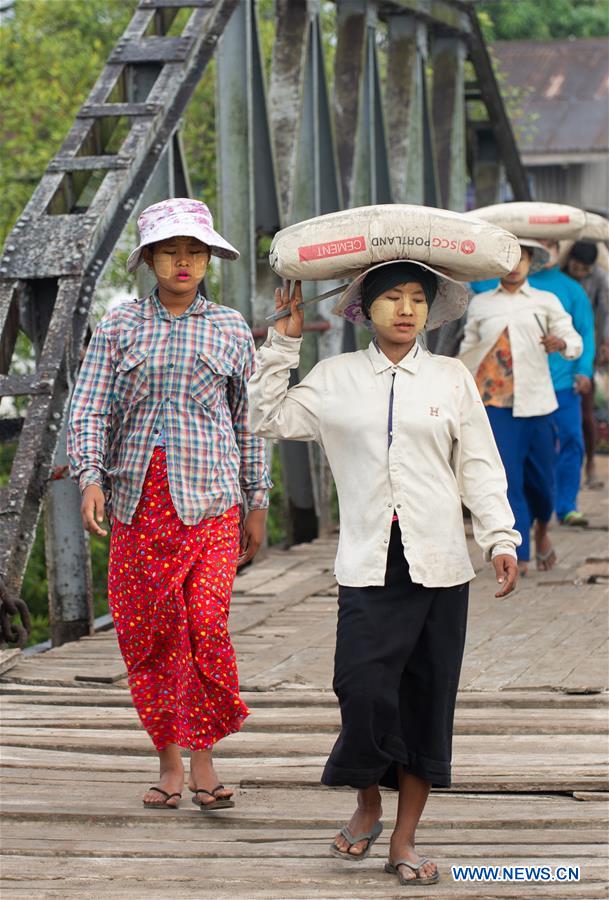MYANMAR-KYAUKPYU-PIER-FEMALE WORKER