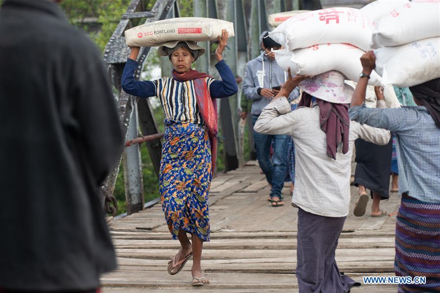 MYANMAR-KYAUKPYU-PIER-FEMALE WORKER