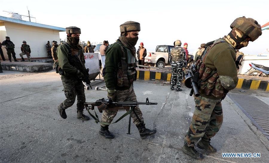 security force members take position during gun fight in jammu