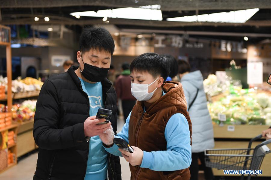 CHINA-BEIJING-NOVEL CORONAVIRUS-STAFF-SHARING (CN)