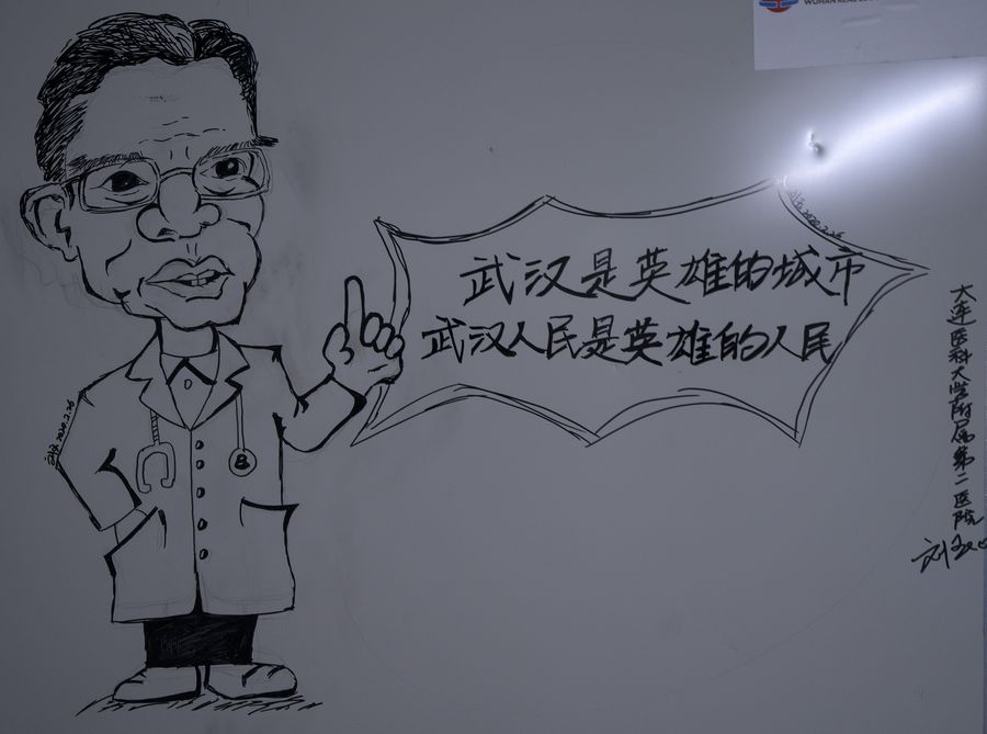 Medics draw cartoons on ward wall to cheer up COVID-19 patients in China -  Xinhua 