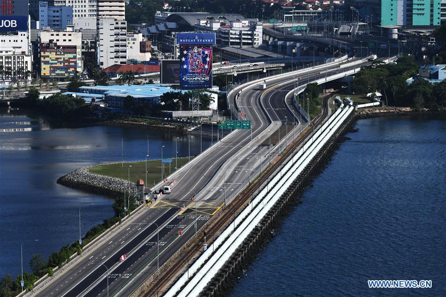 SINGAPORE-MALAYSIA-COVID-19-MEASURES