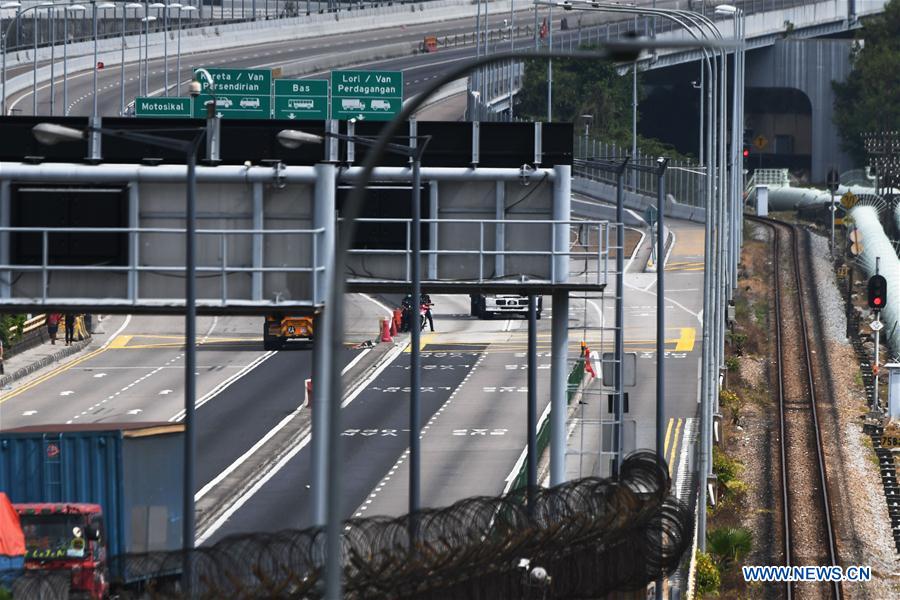 SINGAPORE-MALAYSIA-COVID-19