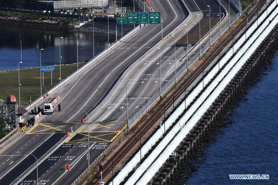 SINGAPORE-MALAYSIA-COVID-19