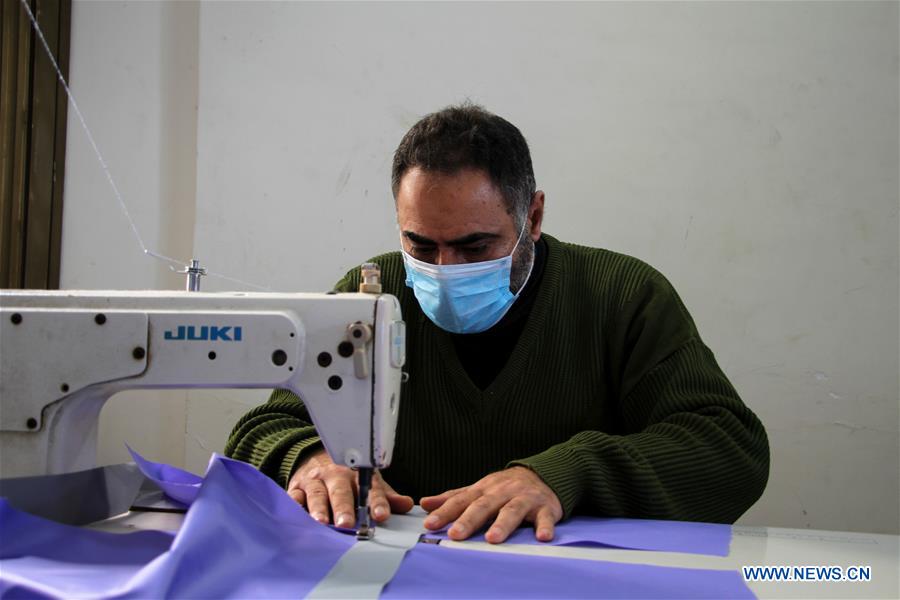 MIDEAST-GAZA-BEIT LAHIA-COVID-19-PROTECTIVE SUITS-PRODUCTION
