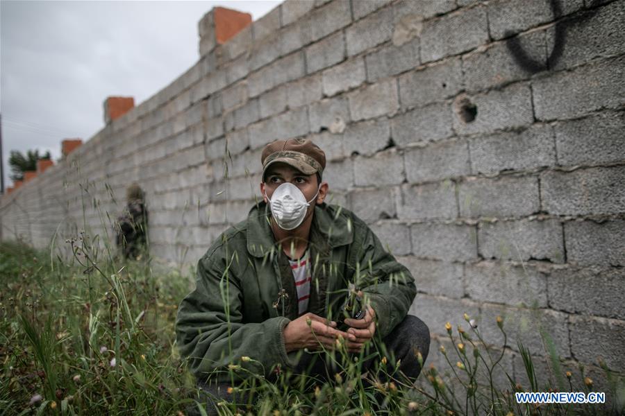 (PORTRAITS)LIBYA-TRIPOLI-CONFLICT-COVID-19