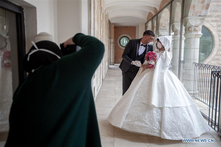 MIDEAST-BETHLEHEM-COVID-19-WEDDING