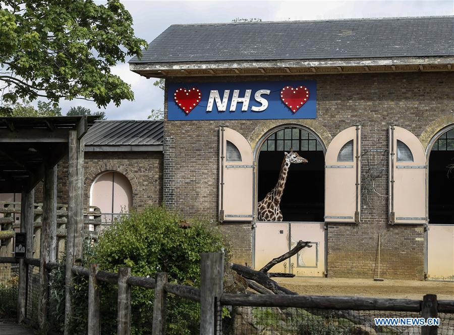 Illuminated sign in support of NHS seen at London Zoo Xinhua