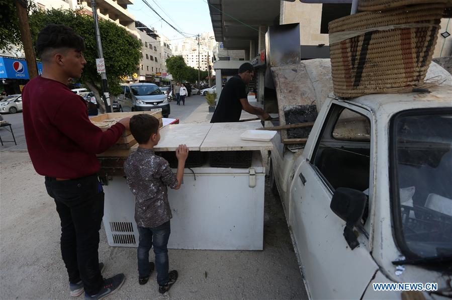 MIDEAST-NABLUS-COVID-19-BAKER