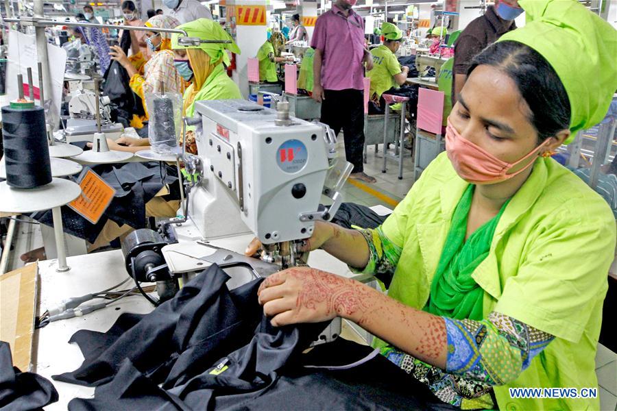 Workers work at garment factory in Dhaka, Bangladesh Xinhua English.news.cn