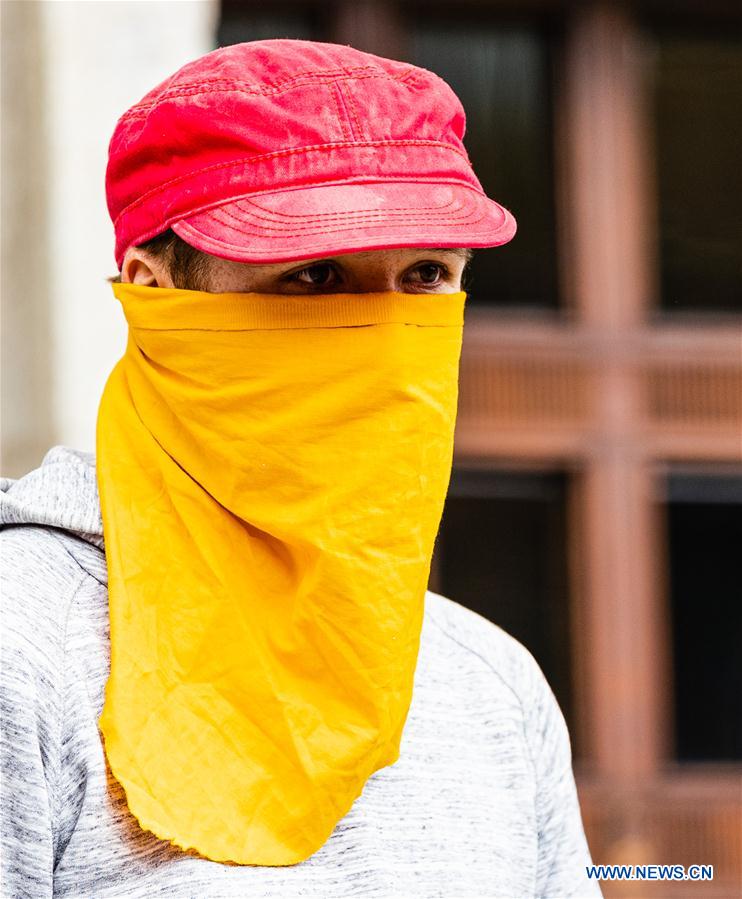 People wear face mask in Berlin, Germany Xinhua English.news.cn