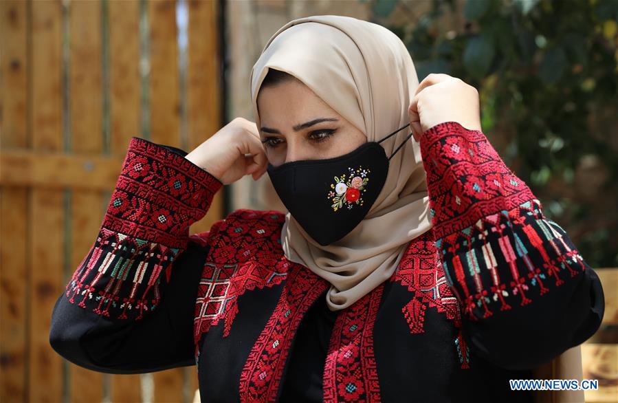 MIDEAST-HEBRON-COVID-19-MASK-EMBROIDERY