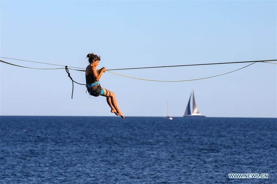 Woman practises on slackline in Croatia Xinhua English.news.cn
