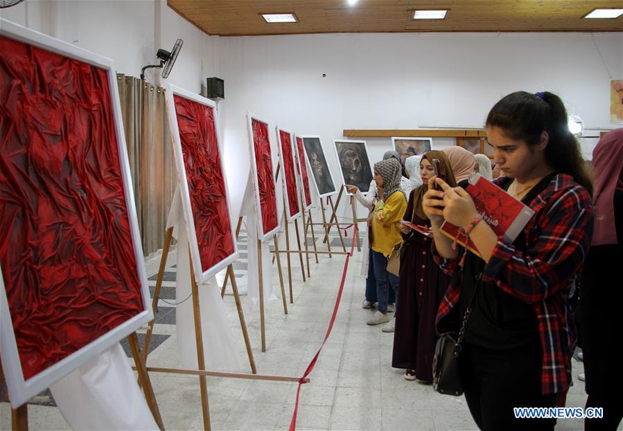 MIDEAST-GAZA CITY-EXHIBITION-PAINTINGS-VIOLENCE AGAINST WOMEN