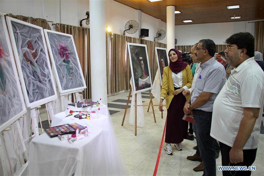 MIDEAST-GAZA CITY-EXHIBITION-PAINTINGS-VIOLENCE AGAINST WOMEN