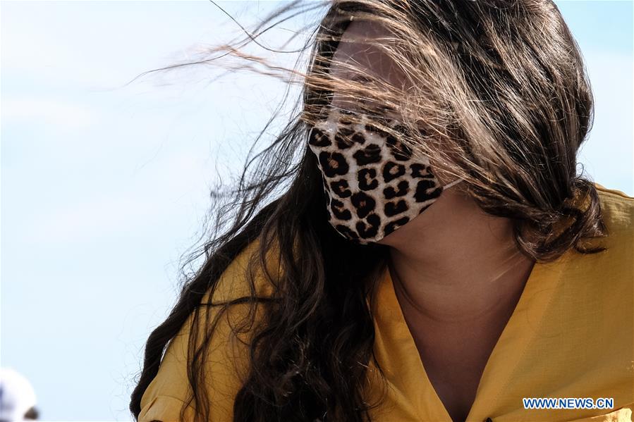 People wear face masks in France Xinhua English.news.cn