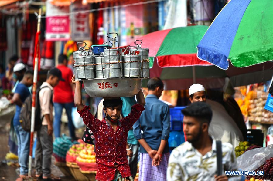 Delivery persons deliver food for officegoers in Dhaka, Bangladesh