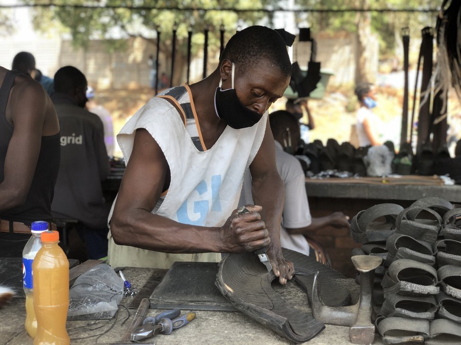 Feature: Zimbabwean man turns old car tires into innovative footwear -  Xinhua