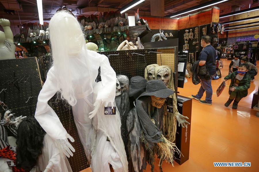 People shop for Halloween costumes in Vancouver, Canada Xinhua