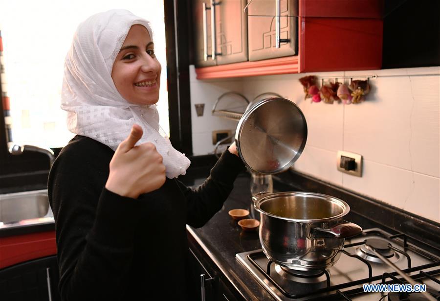 SYRIA-DAMASCUS-DEAF WOMAN-COOKING-BROADCAST