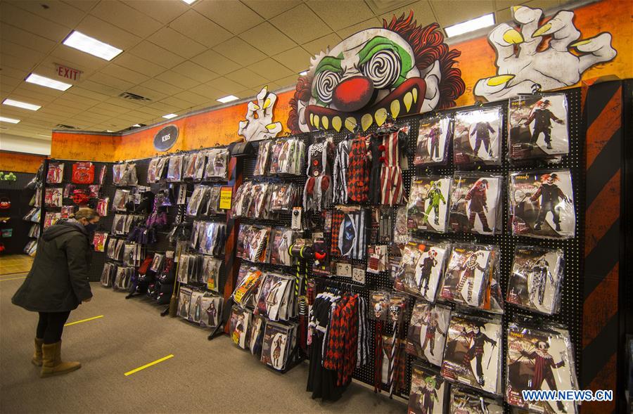 People shop for decorations for Halloween in Ontario, Canada