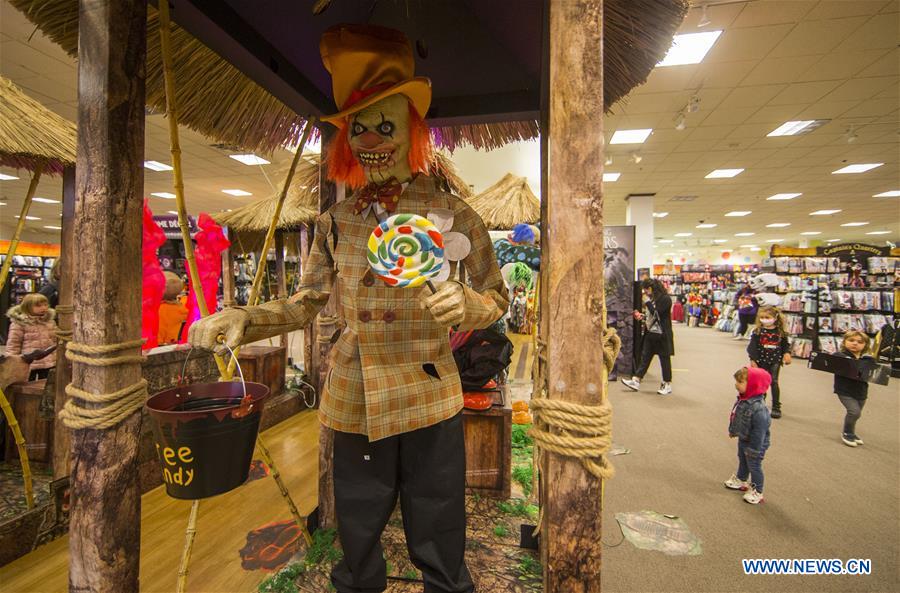 People shop for decorations for Halloween in Ontario, Canada