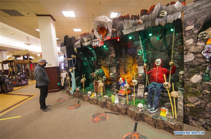 People shop for decorations for Halloween in Ontario, Canada
