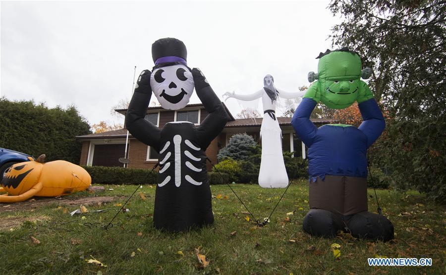 People shop for decorations for Halloween in Ontario, Canada