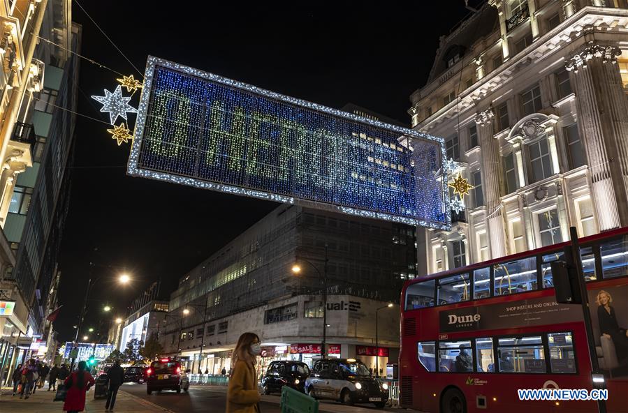 Christmas lights illuminate main shopping Oxford Street in London