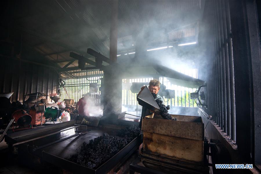 Pic story family business heir dedicated to producing charcoal roasted