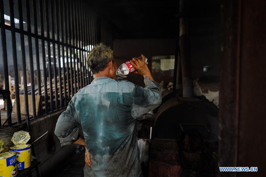 Pic story family business heir dedicated to producing charcoal roasted