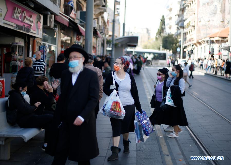 people wear face masks in jerusalem amid covid-19 pandemic