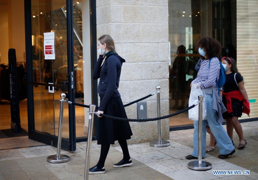 people wear face masks in jerusalem amid covid-19 pandemic