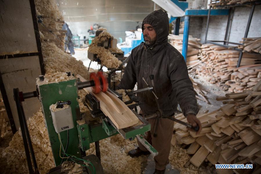 In pics cricket bat factory in Indiancontrolled Kashmir Xinhua