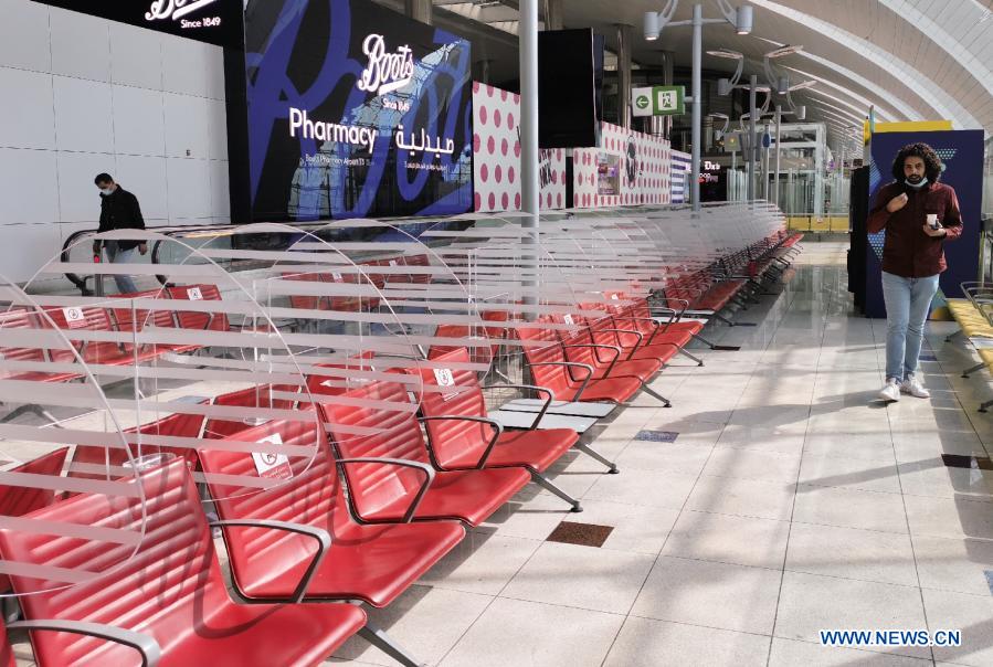 People wearing masks seen at International Airport of Dubai Xinhua