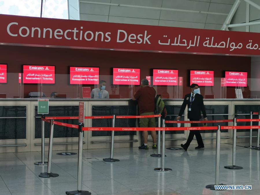 People wearing masks seen at International Airport of Dubai Xinhua