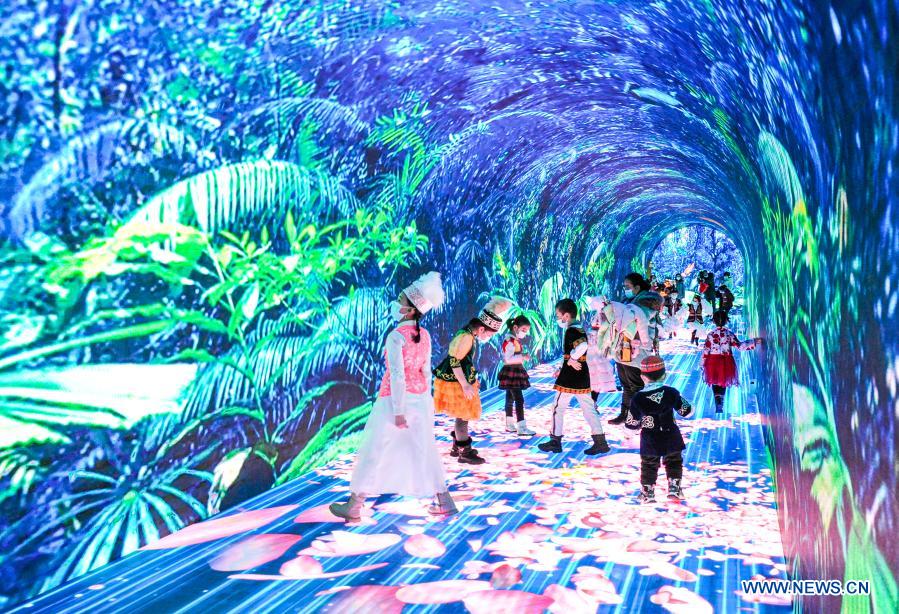 Children play at immersivedigital entertainment experience tunnel in