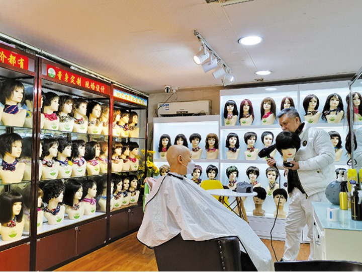 Feature: Beijing barbershop offers wigs that comfort, if not cure - Xinhua  